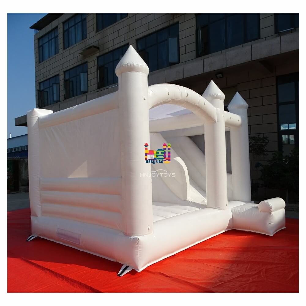 white bounce house with slide with air blower
