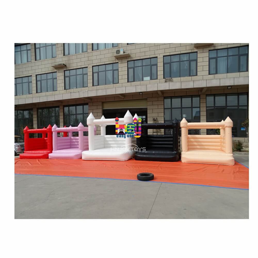 white and pastel castle jumper inflatable bounce house