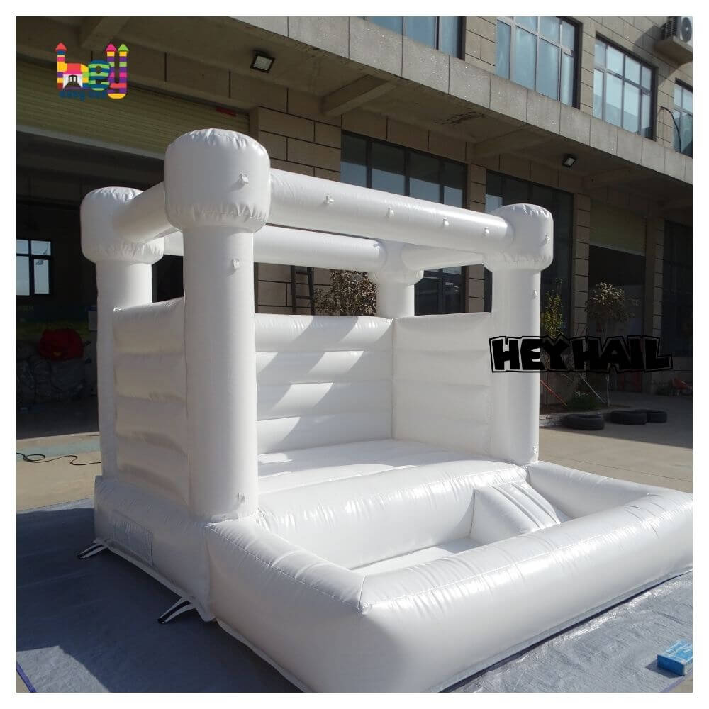 commercial white bounce house with ball pit