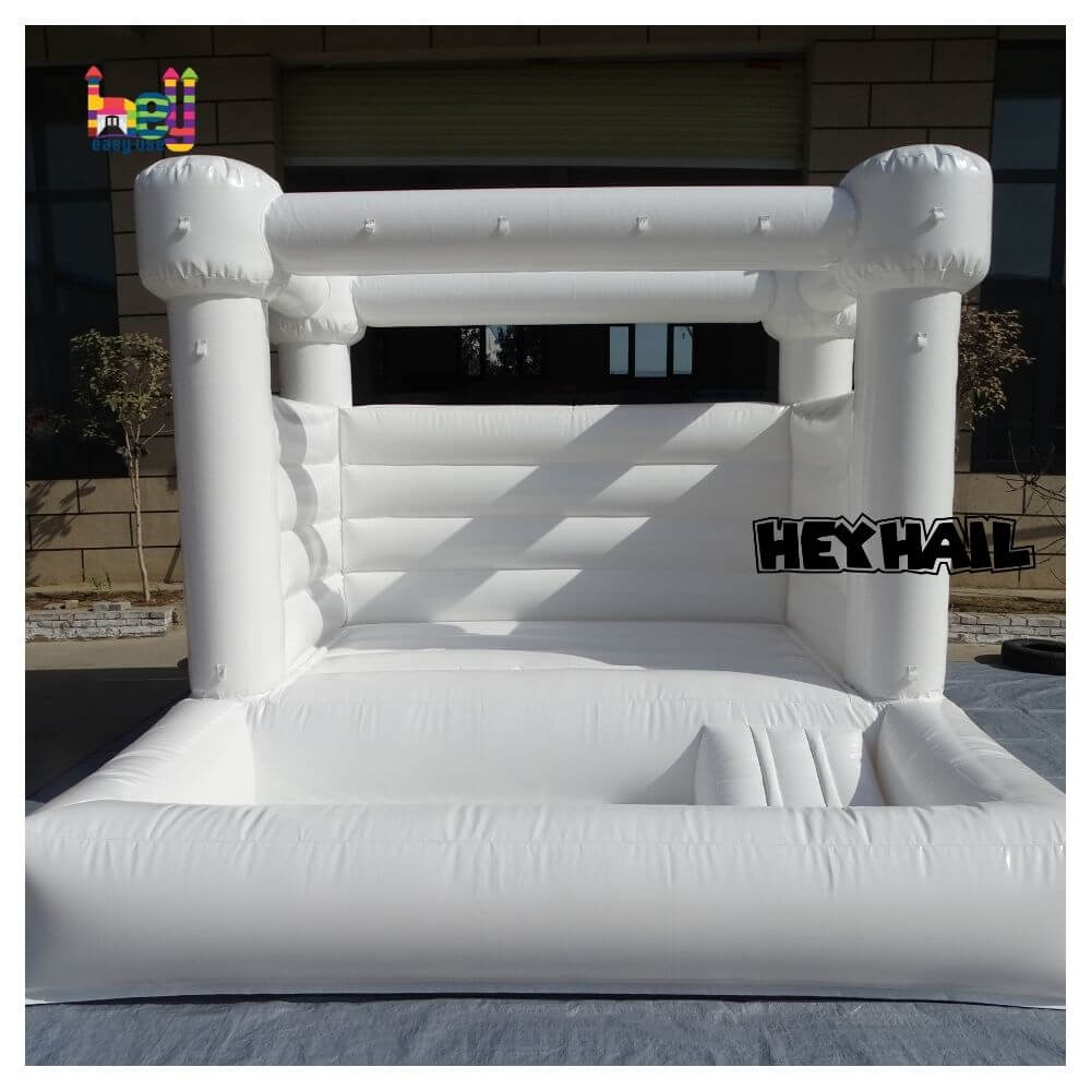 commercial white bounce house with ball pit