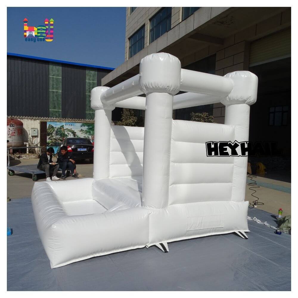 commercial white bounce house with ball pit