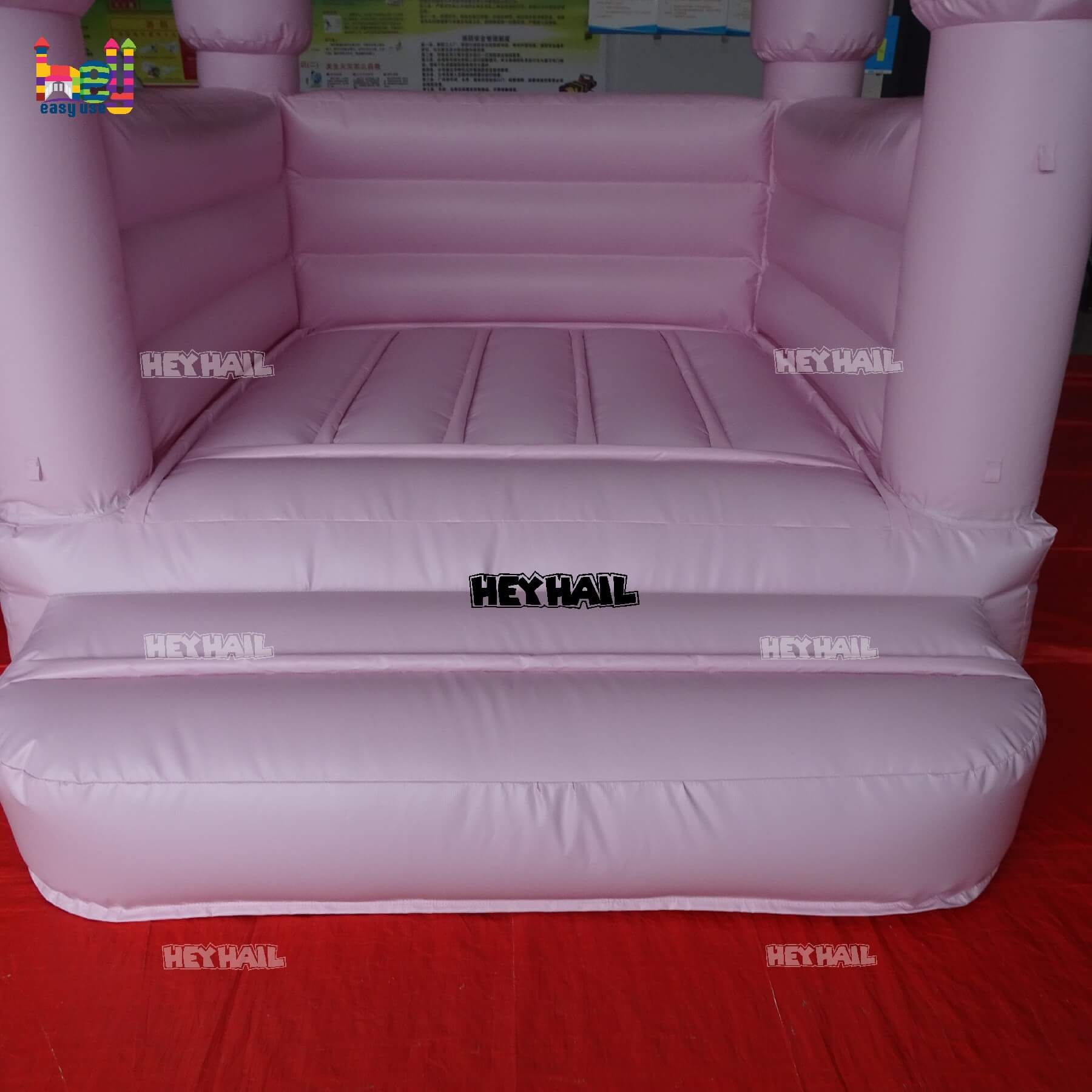 commercial light pastel pink bounce house on promotion