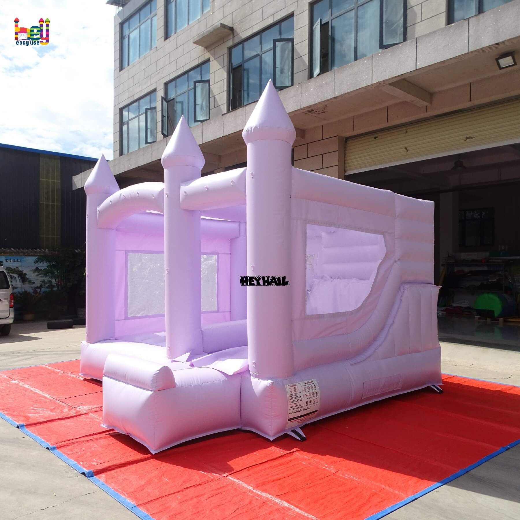 outdoor inflatable lavender bounce house with slide