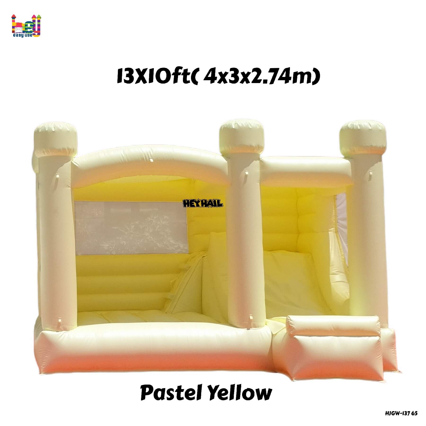 inflatable pastel yellow bounce house with slide